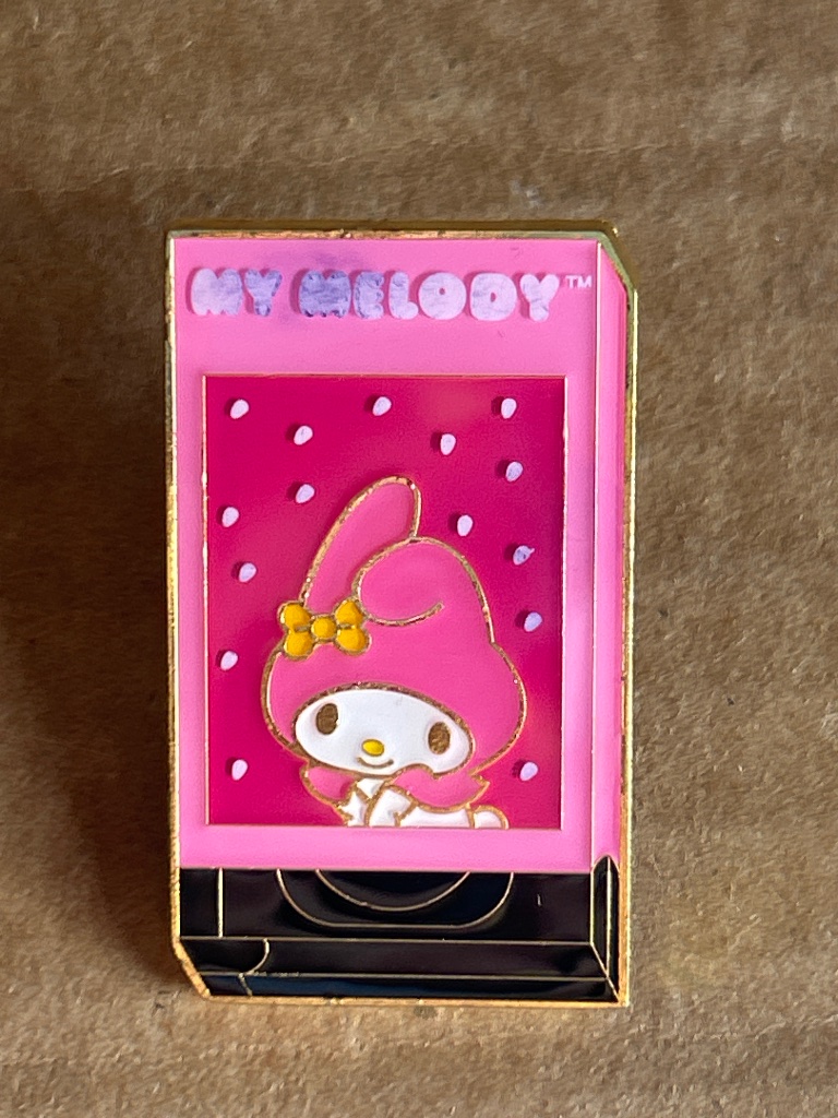 Loungefly My Melody Sanrio VHS tape enamel pin in a pink video sleeve design